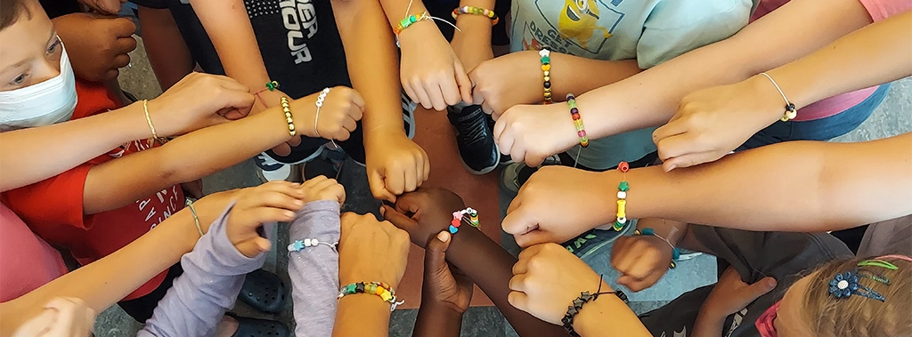campers show off their bracelets
