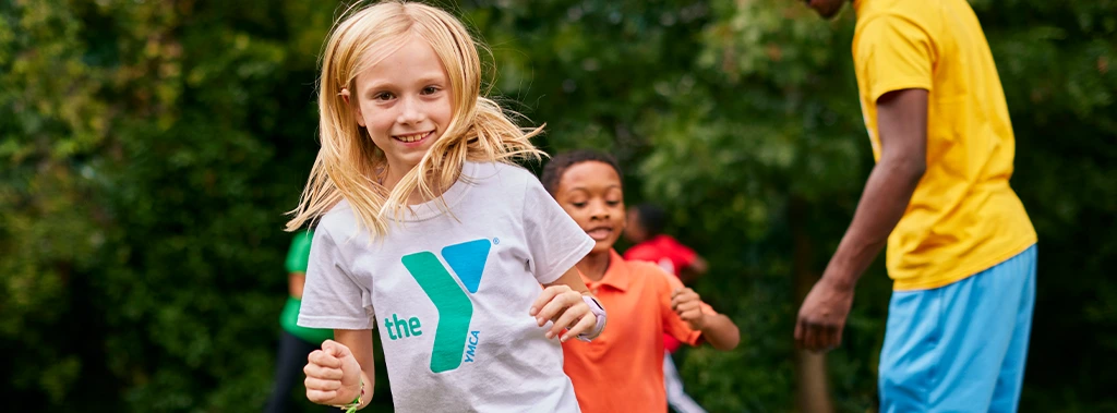 young girl running and playing at the keene family ymca